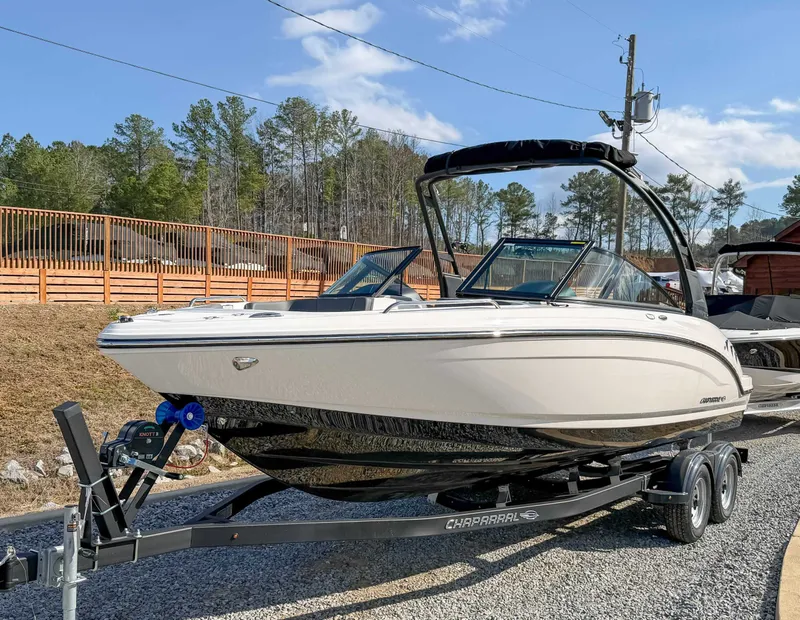 Slide: The Image of 2026 Chaparral 23 SSi boat on trailer, parked outdoors. - 3