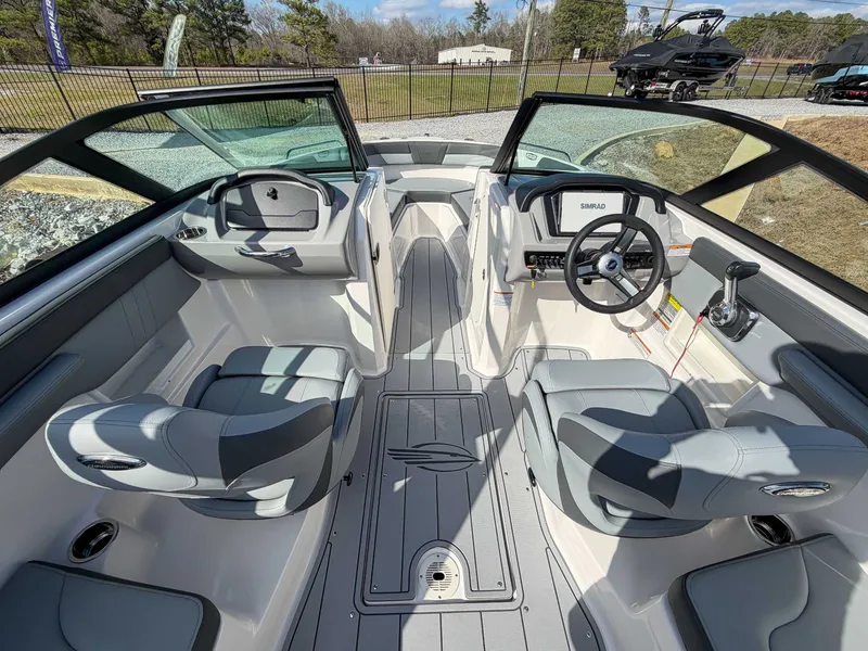 Slide: The Image of Interior of 2026 Chaparral 23 SSi with gray seats and steering console. - 9