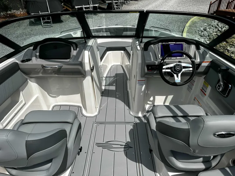 Slide: The Image of Interior of 2026 Chaparral 23 SSi with gray seats and steering console. - 13