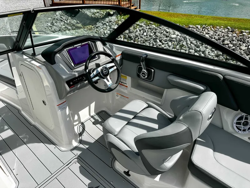 Slide: The Image of Interior of 2026 Chaparral 23 SSi with modern helm station. - 19