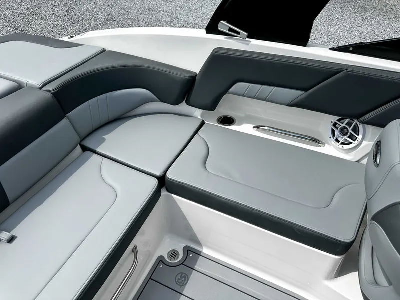 Slide: The Image of 2026 Chaparral 23 SSi interior with gray upholstery. - 23