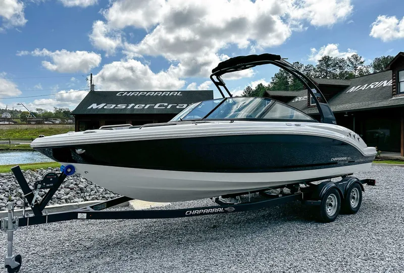Slide: The Image of 2026 Chaparral 23 SSi boat on trailer in front of store. - 3