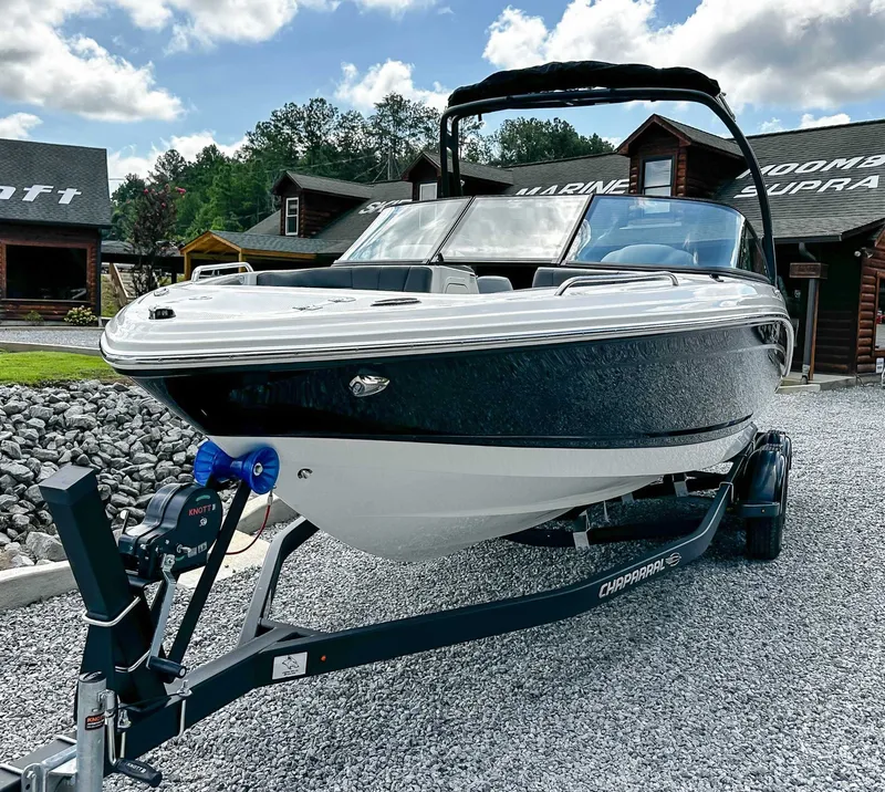 Slide: The Image of 2026 Chaparral 23 SSi boat on trailer, parked outdoors. - 4