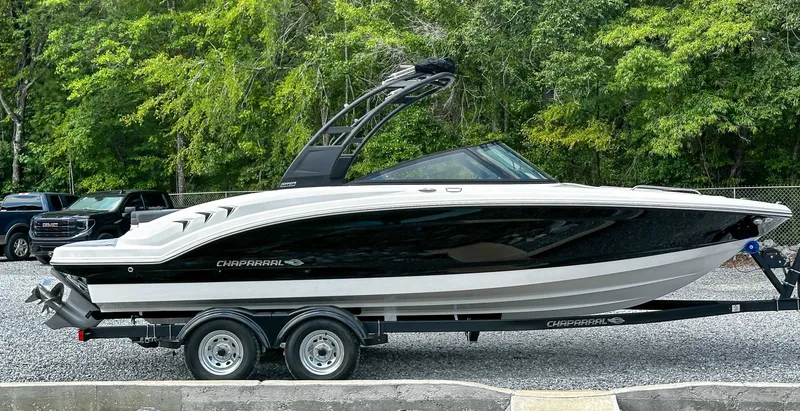 Slide: The Image of Chaparral 23 SSi 2026 on trailer, side view outdoors. - 7