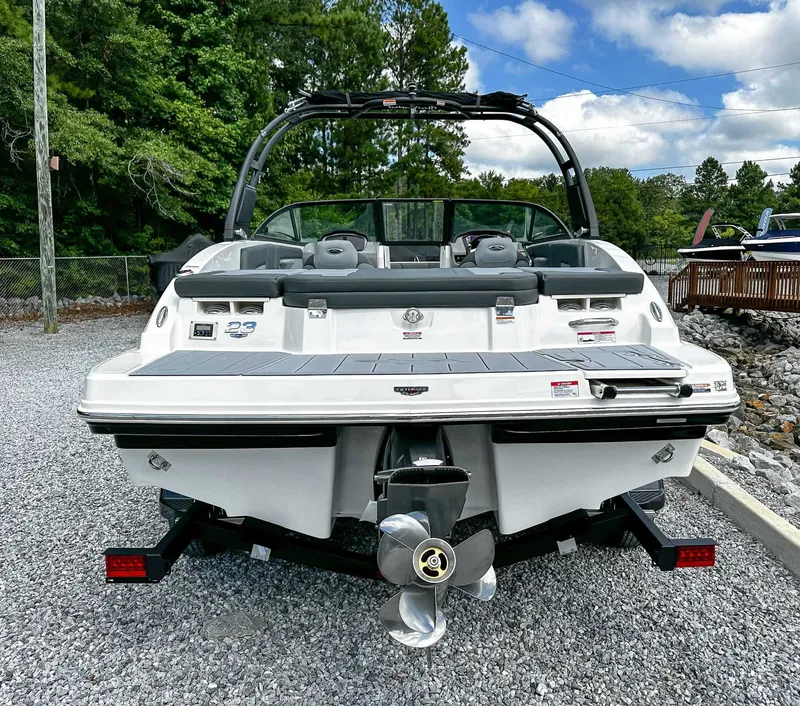 Slide: The Image of Rear view of 2026 Chaparral 23 SSi boat on gravel. - 9