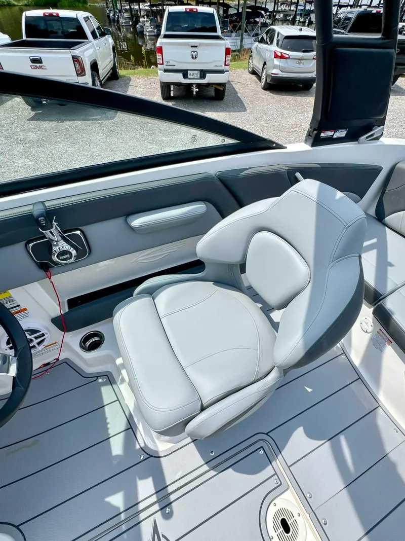 Slide: The Image of Interior of 2026 Chaparral 21 SSi with gray seating. - 13