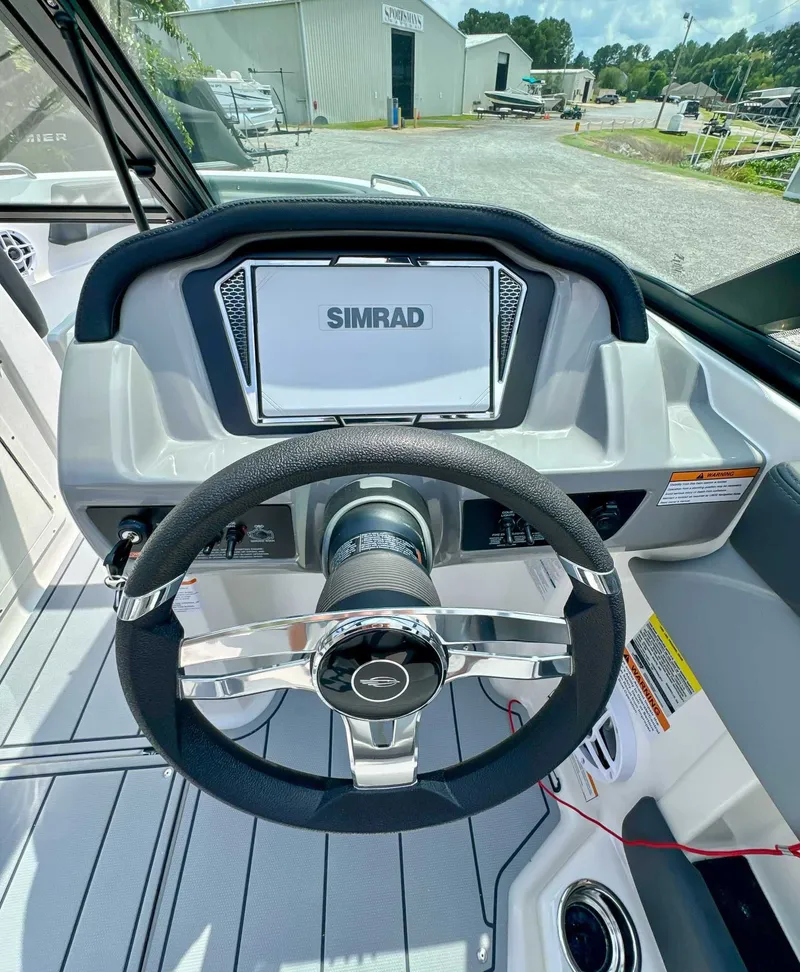 Slide: The Image of Steering wheel and dashboard of 2026 Chaparral 21 SSi with Simrad display. - 14