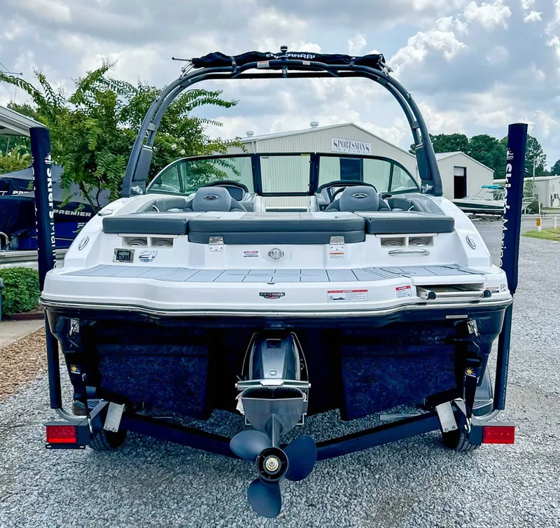Slide: The Image of Rear view of a 2026 Chaparral 21 SSi boat on a trailer. - 9