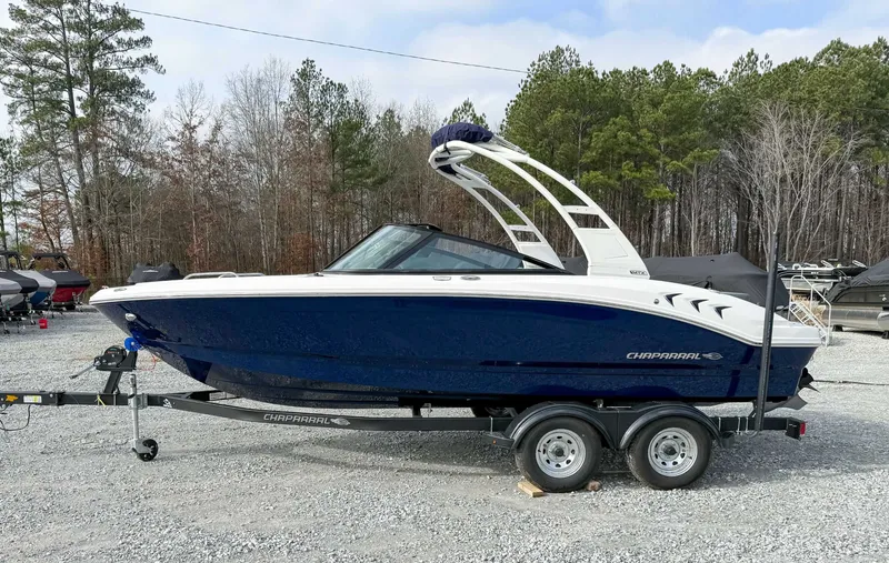 The Image of 2026 Chaparral 21 SSi boat on trailer outdoors. - 1