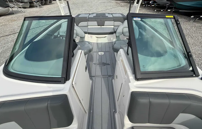 Slide: The Image of Interior view of 2026 Chaparral 21 SSi boat with gray seating. - 15