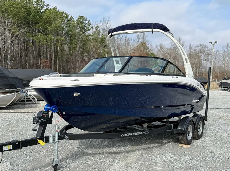 Slide: The Image of 2026 Chaparral 21 SSi boat parked on trailer outdoors. - 3