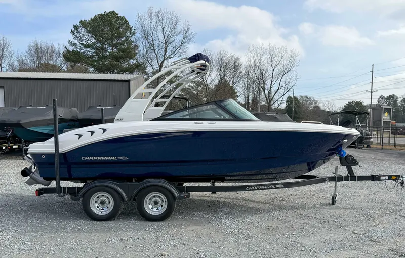 Slide: The Image of 2026 Chaparral 21 SSi boat parked on trailer outdoors. - 6