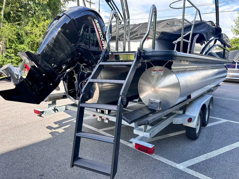 Slide: The Image of Harris Cruiser 230 SLDH 2026 on trailer with Mercury engine. - 10