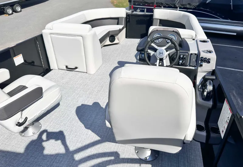 Slide: The Image of Interior of 2026 Harris Cruiser 230 SLDH with steering wheel and seats. - 12