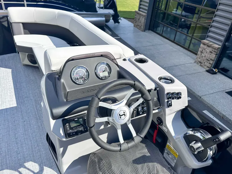 Slide: The Image of Interior view of 2026 Harris Cruiser 230 SLDH, helm console and seating area. - 17
