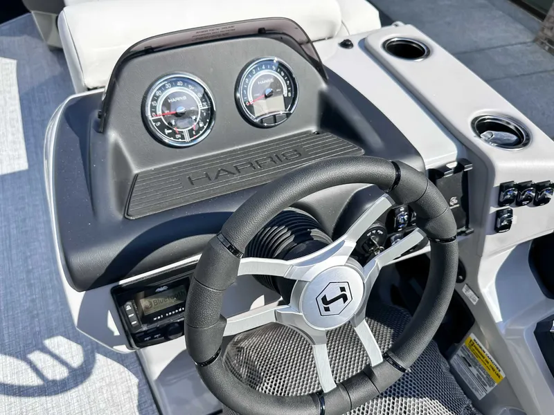 Slide: The Image of Steering wheel and dashboard of 2026 Harris Cruiser 230 SLDH. - 18