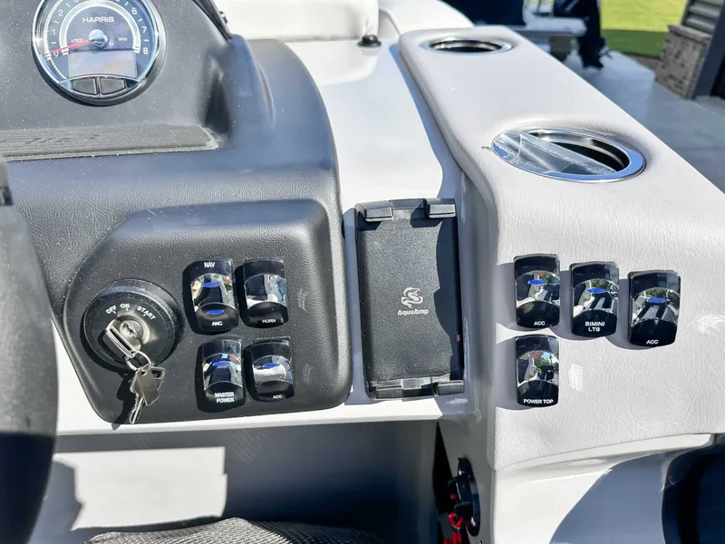 Slide: The Image of Dashboard of 2026 Harris Cruiser 230 SLDH with switches and speedometer. - 20