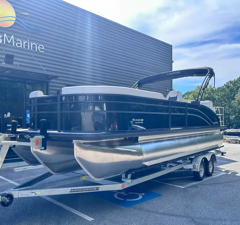 Slide: The Image of Harris Cruiser 230 SLDH 2026 on trailer outside a building. - 3