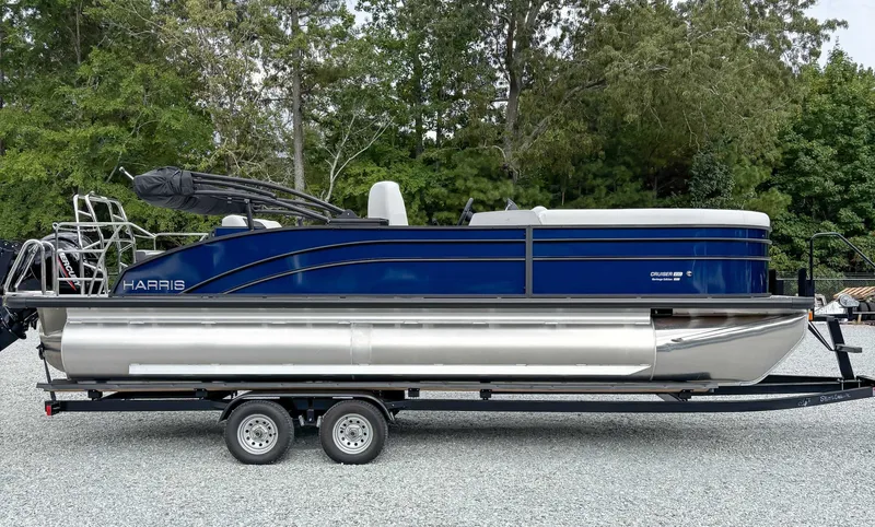The Image of 2026 Harris Cruiser 230 SLDH boat on trailer outdoors. - 1