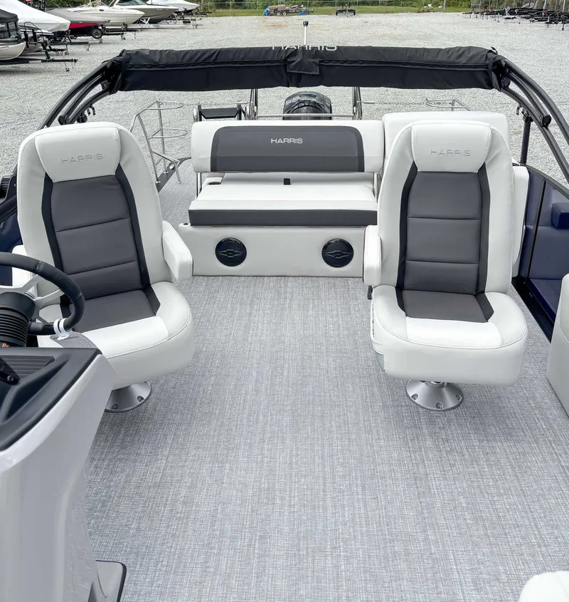 Slide: The Image of Interior of 2026 Harris Cruiser 230 SLDH with luxurious seating. - 13