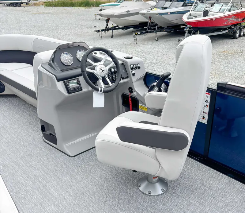 Slide: The Image of Interior of 2026 Harris Cruiser 230 SLDH with steering console. - 15