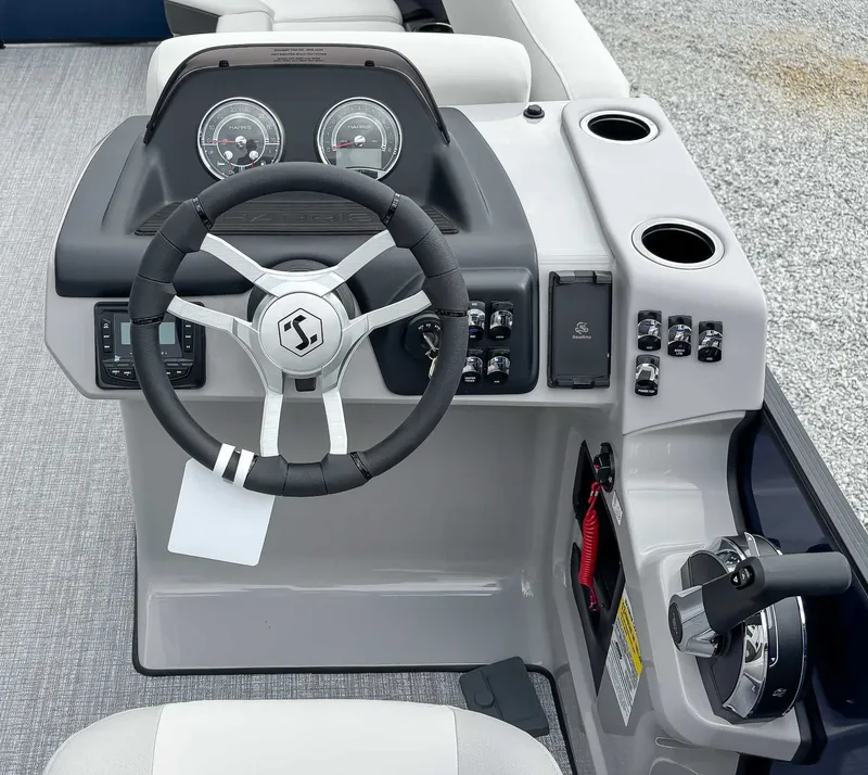 Slide: The Image of 2026 Harris Cruiser 230 SLDH helm with modern controls and steering wheel. - 16