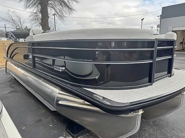 The Image of Harris Cruiser 230 SLDH 2026 pontoon boat, Heritage Edition, on parking lot. - 1