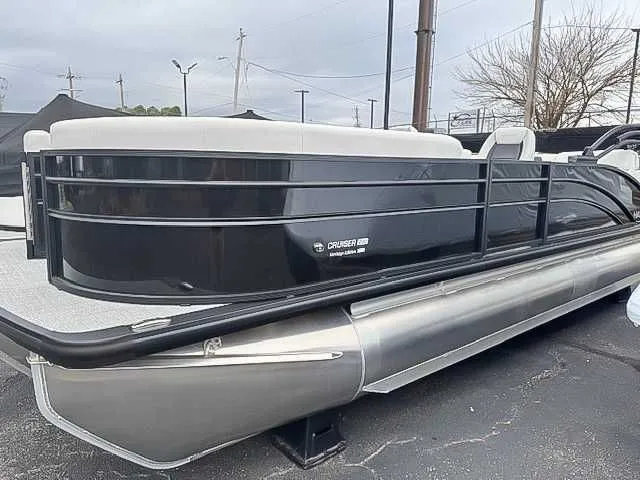 Slide: The Image of 2026 Harris Cruiser 230 SLDH pontoon boat, Heritage Edition, on parking lot. - 4