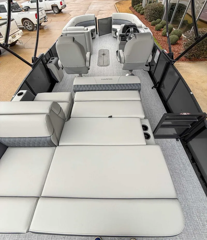 Slide: The Image of Interior of 2026 Harris Cruiser 230 SLDH with luxurious seating. - 11