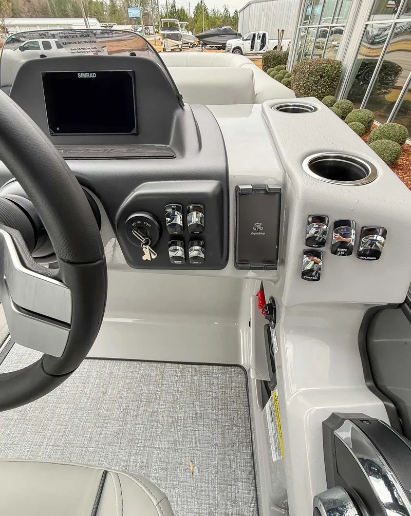 Slide: The Image of Dashboard of 2026 Harris Cruiser 230 SLDH with controls and display. - 18