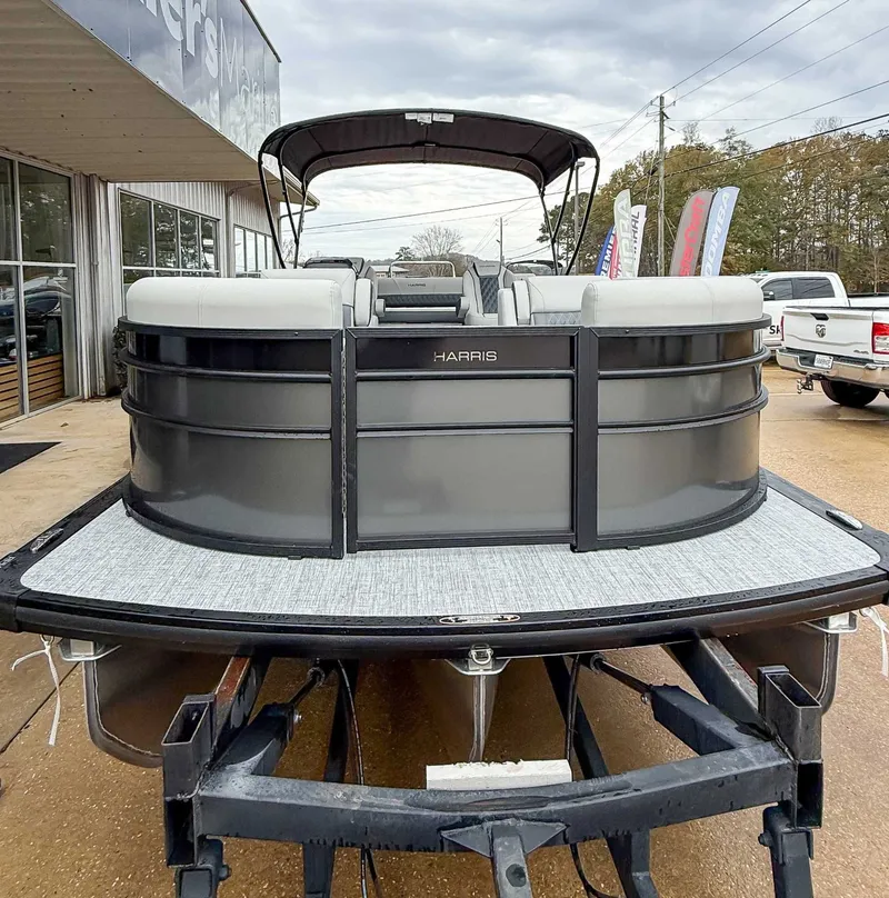 Slide: The Image of Harris Cruiser 230 SLDH 2026 on trailer outside a building. - 4