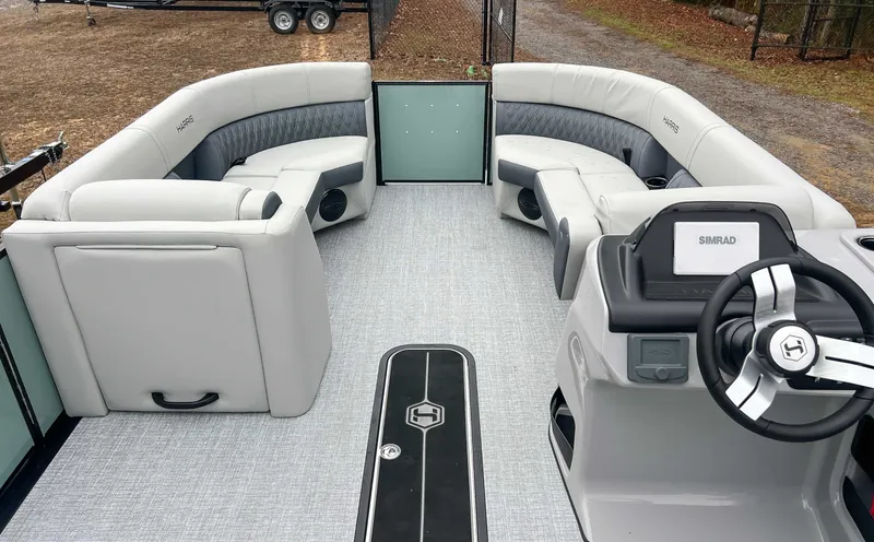 Slide: The Image of Interior of 2026 Harris Cruiser 230 SLDH with luxurious seating. - 12