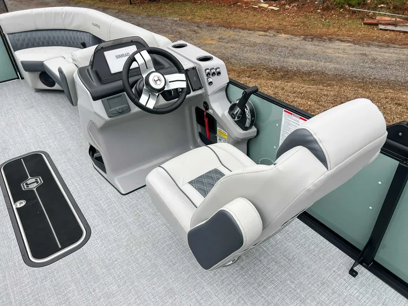 Slide: The Image of Interior of 2026 Harris Cruiser 230 SLDH with steering wheel and seats. - 18