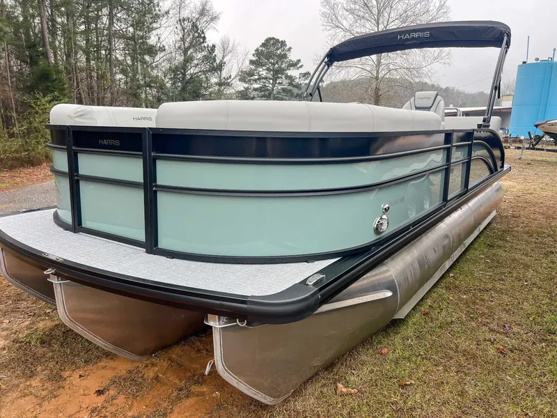 Slide: The Image of 2026 Harris Cruiser 230 SLDH pontoon boat parked on grass. - 5