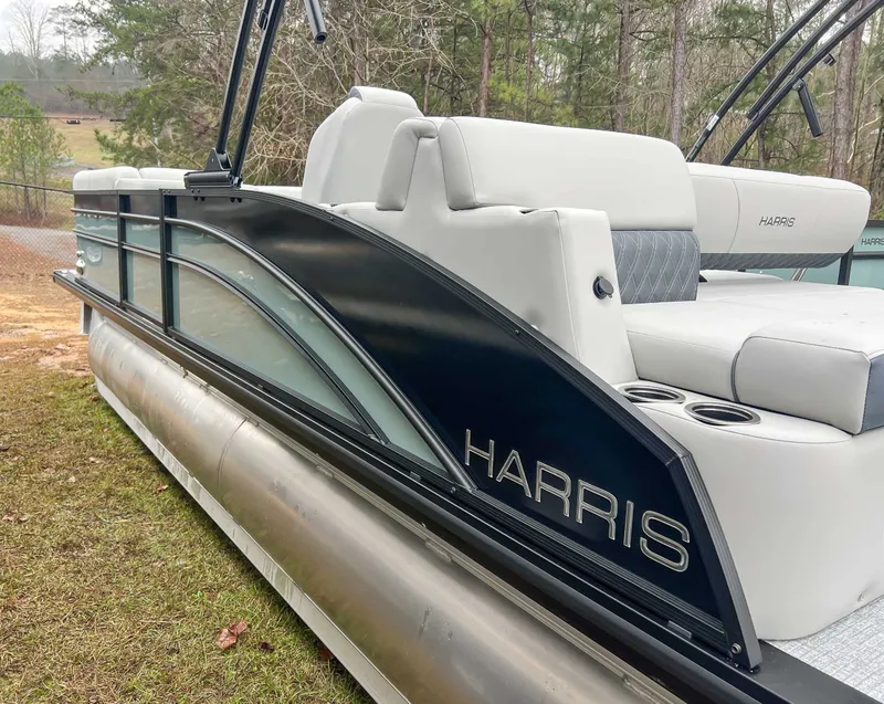 Slide: The Image of Harris Cruiser 230 SLDH 2026 pontoon boat on grass. - 6