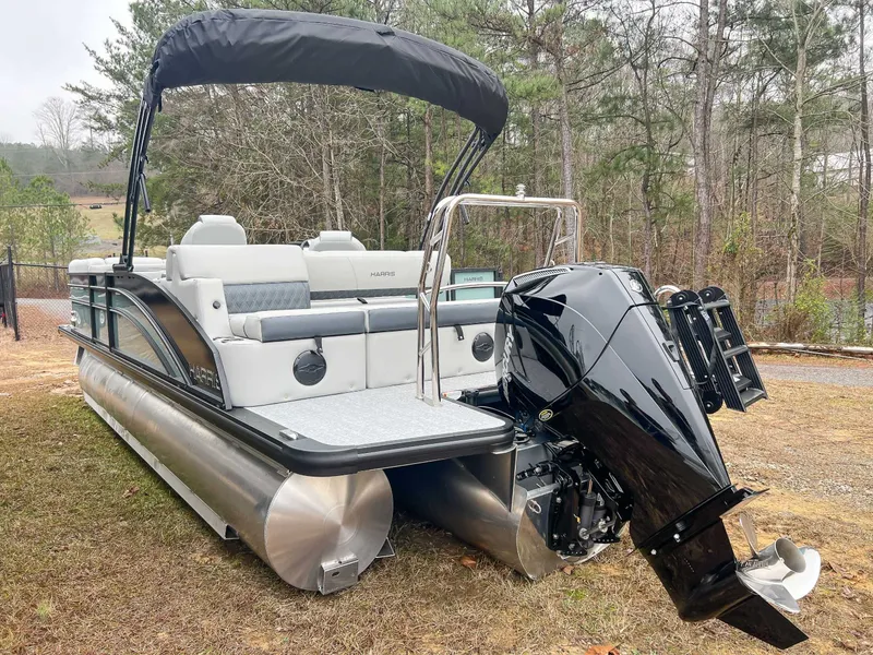 Slide: The Image of Harris Cruiser 230 SLDH 2026 pontoon boat parked outdoors. - 7