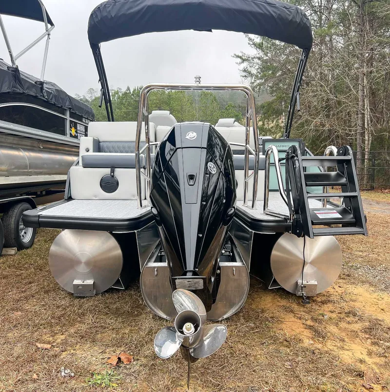 Slide: The Image of 2026 Harris Cruiser 230 SLDH with outboard motor and bimini top. - 9