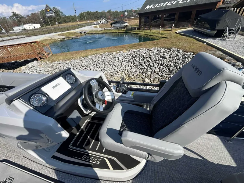Slide: The Image of Interior of 2026 Harris Solstice 230 SLDH with steering console. - 10
