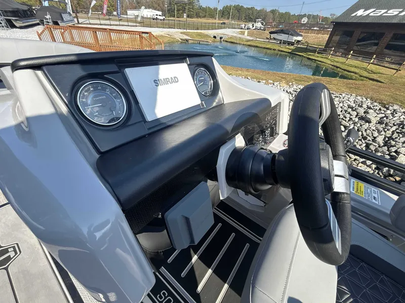 Slide: The Image of Dashboard of 2026 Harris Solstice 230 SLDH with Simrad display. - 17