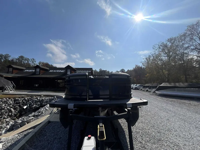 Slide: The Image of Harris Solstice 230 SLDH 2026 boat on gravel lot under sunny sky. - 4