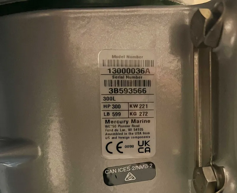 Slide: The Image of Mercury Marine engine label with serial number and specifications. - 24