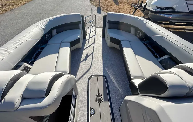 Slide: The Image of Interior of 2026 Harris Grand Mariner 230 SLDH with gray leather seating. - 12