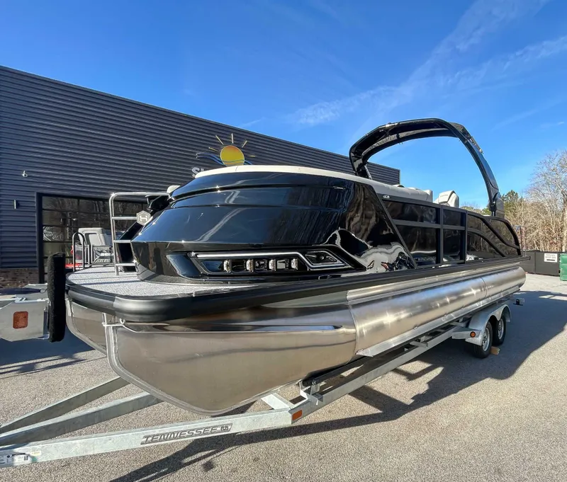 Slide: The Image of 2026 Harris Grand Mariner 230 SLDH on trailer, blue sky. - 5