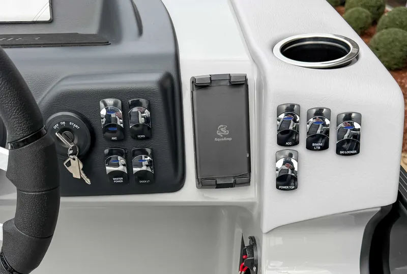 Slide: The Image of Dashboard of 2026 Harris Cruiser 250 SLDH with switches and ignition key. - 16
