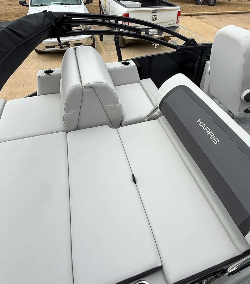 Slide: The Image of Harris Cruiser 250 SLDH 2026 with gray upholstery and lounging area. - 18