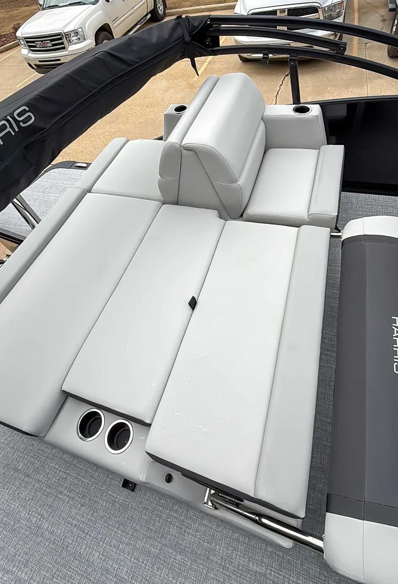Slide: The Image of 2026 Harris Cruiser 250 SLDH with gray upholstery and cup holders. - 19