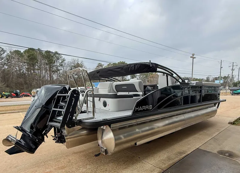 Slide: The Image of 2026 Harris Cruiser 250 SLDH pontoon boat on a parking lot. - 6