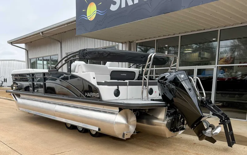 Slide: The Image of Harris Cruiser 250 SLDH 2026 pontoon boat outside a building. - 7