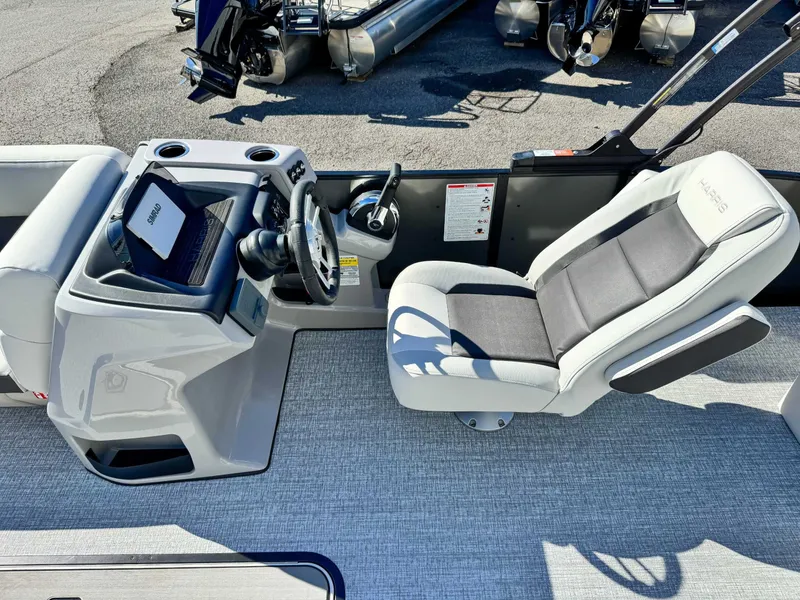 Slide: The Image of Interior of 2026 Harris Cruiser 230 SLDH with helm and seat. - 16