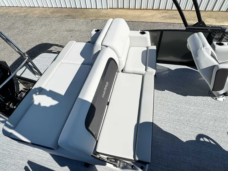 Slide: The Image of 2026 Harris Cruiser 230 SLDH boat with luxurious white seating. - 19